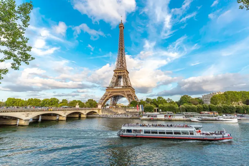 A river boat passing the Eiffel Tower on the Seine