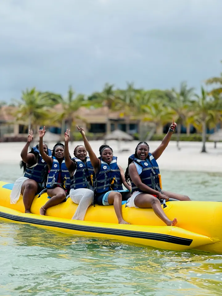 Friends cheering on a banana boat in Mozambique