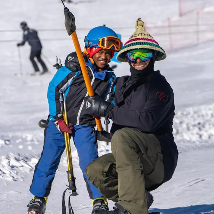 Two skiers posing on the slope in Lesotho